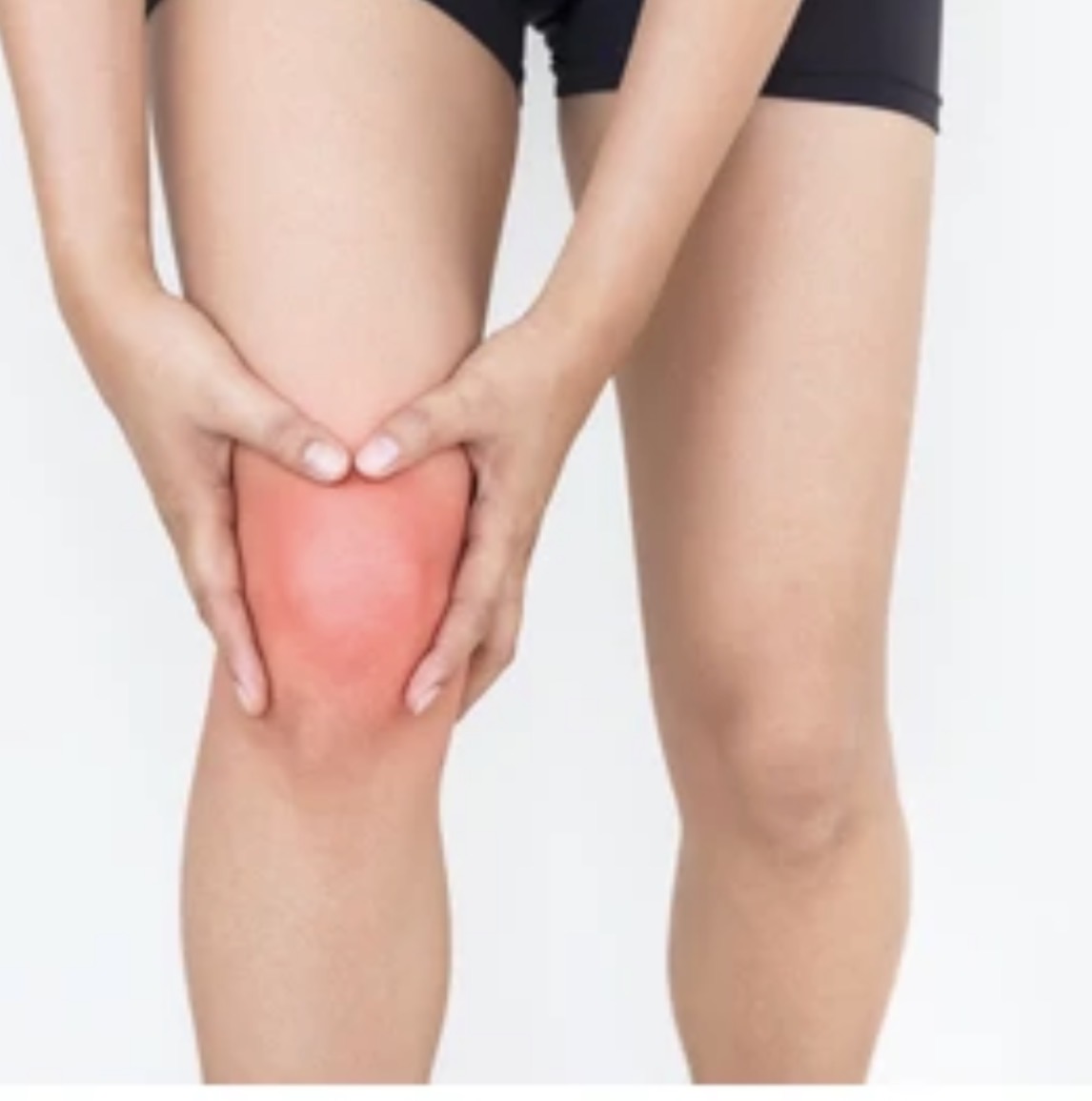Person holding their knee in pain
